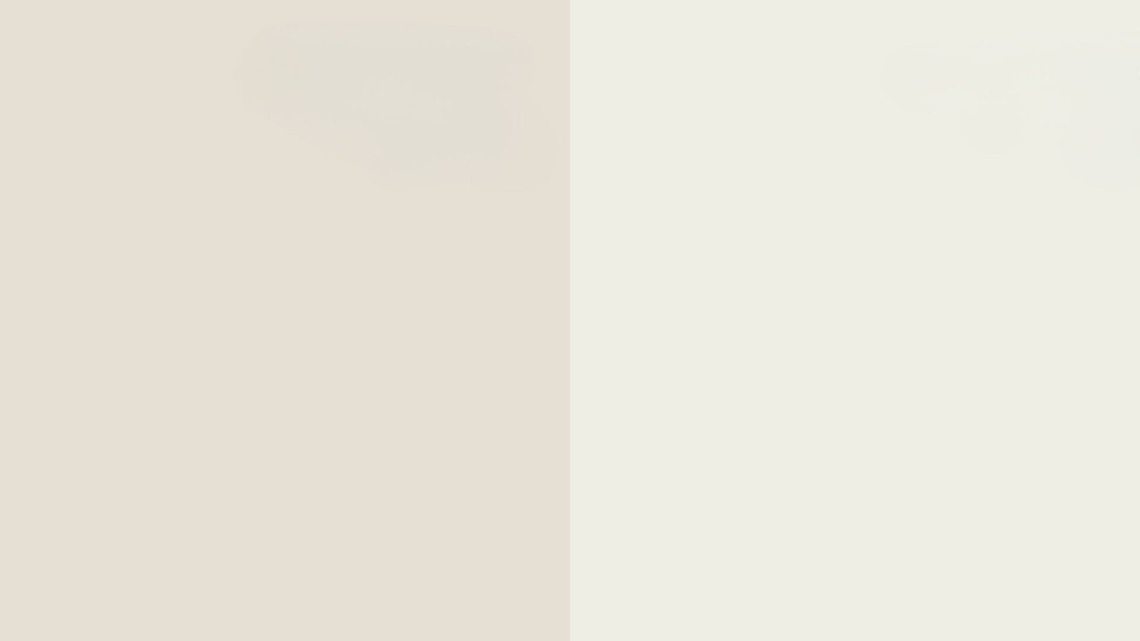Colorful blue and yellow paint splashes against a plain white wall background.